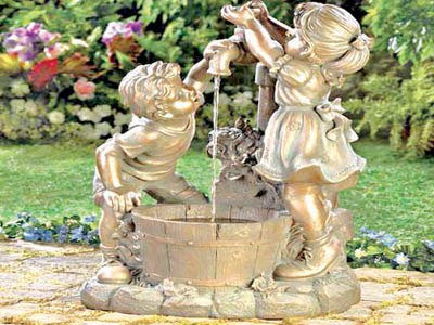 Boy and girl outdoor bronze water fountain