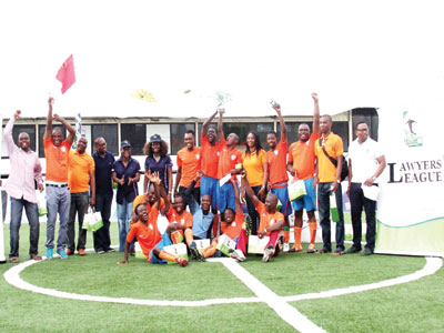 Players and officials of Olisa Agbakoba & Co. celebrating their victory at the end of the 2015 BOA Lawyers League in Lagos… last weekend