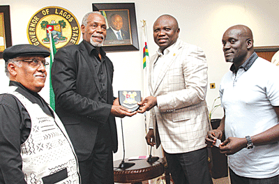 Lagos State Governor, Mr. Akinwunmi Ambode presenting a plaque to Hollywood actor, Mr. Danny Glover, when the cast and crew of 93 Days paid him a courtesy visit last year