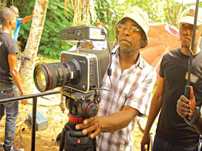 Director of Photography, Mr. Tunji Akinsehinwa and Director, C.J. ‘Fiery’ Obasi on set of O-Town